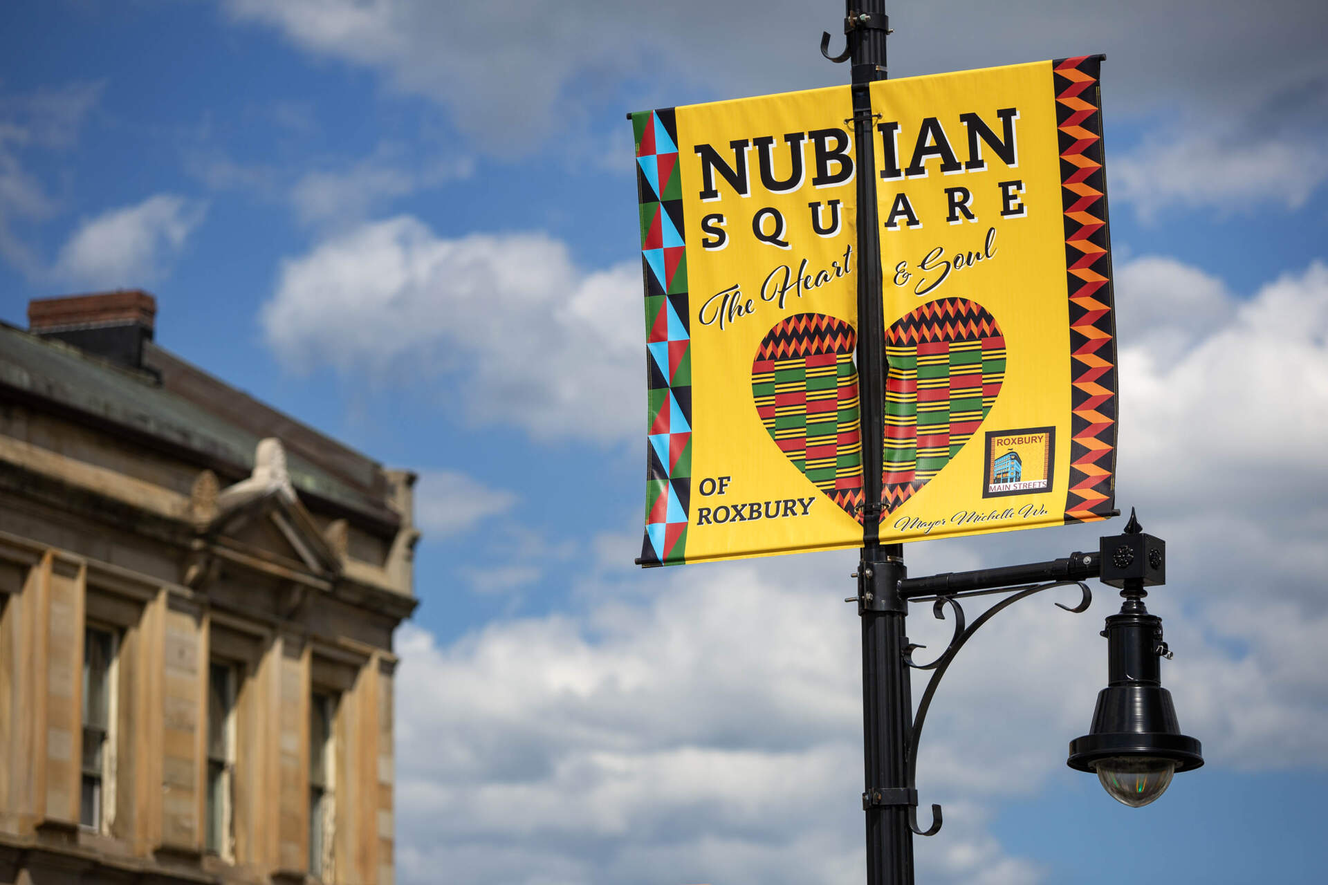 A sign for Nubian Square, the main business district, dubbed "the Heart & Soul of Roxbury" in Boston. (Robin Lubbock/WBUR)