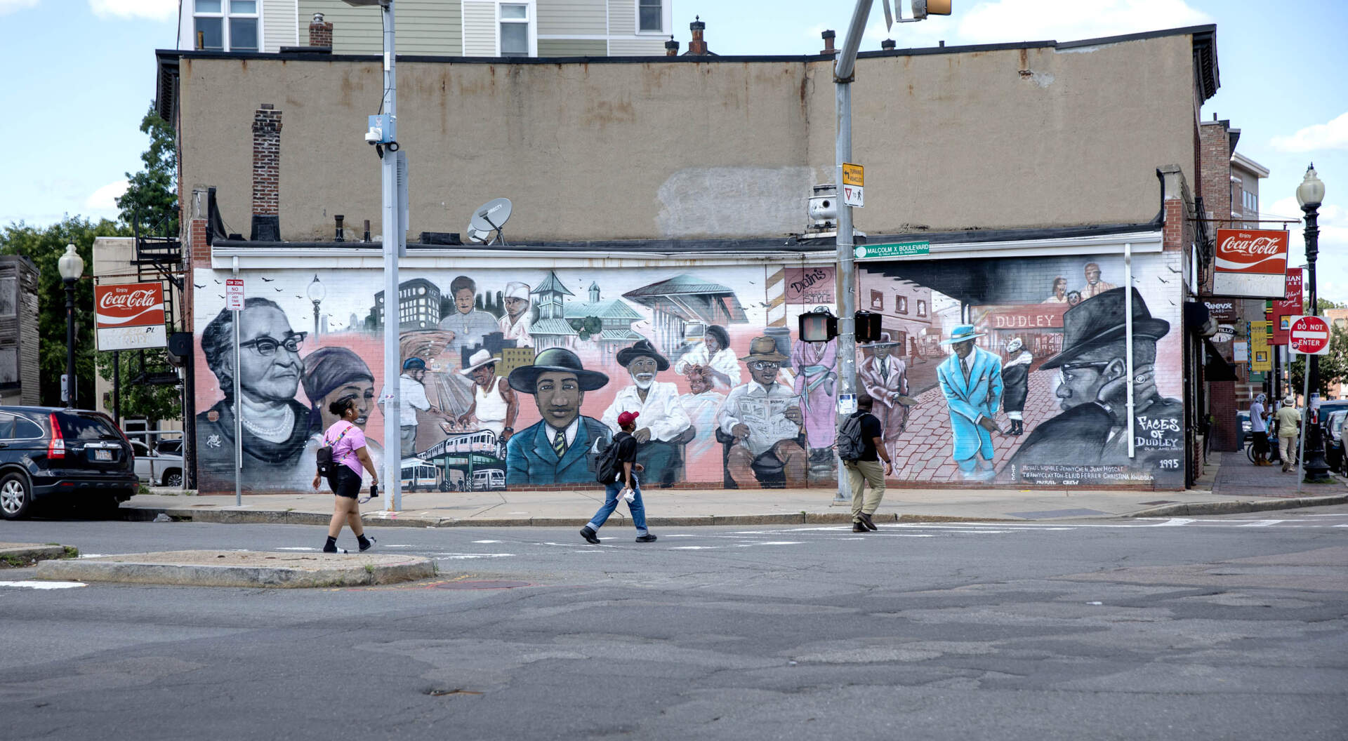 The "Faces of Dudley" mural, on Malcolm X Boulevard in Roxbury's Nubian Square. (Robin Lubbock/WBUR)