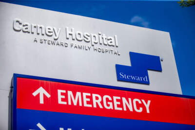 The sign for Steward Health Care's Carney Hospital in Dorchester. (Jesse Costa/WBUR)