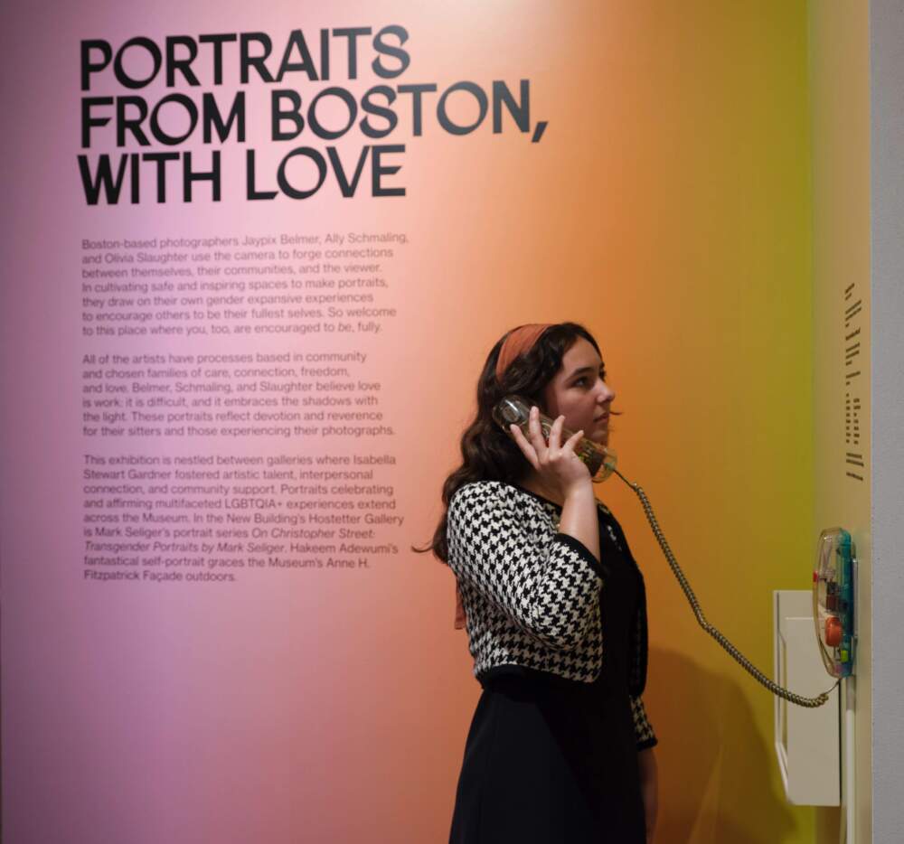 A visitor listening to a message from the "Community Voices Phone" by Crystal Bi. (Courtesy Isabella Stewart Gardner Museum)